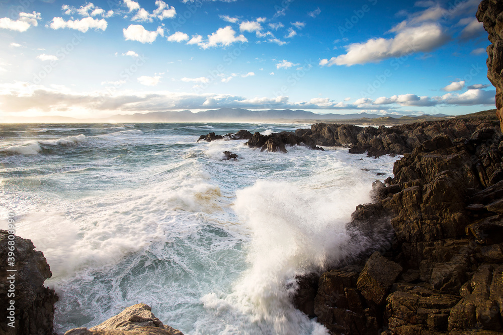 Wide Angle view of huge waves crashing in the cliffs of De Kelders of the coast of Gansbaai in South Africa
