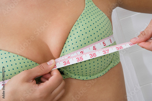 Woman Measuring Breasts photo