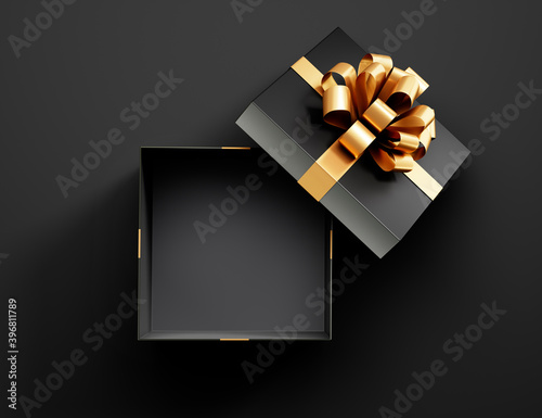 Black opened empty gift box with golden ribbon isolated on black background - 3D illustration
