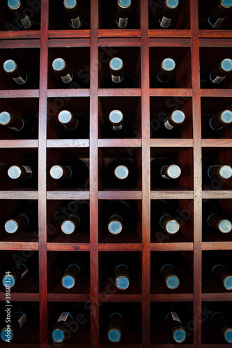 Wide angle view of Wine bottles stacked on a shelf in a wine cellar in the breede river valley in the Western Cape of South Africa