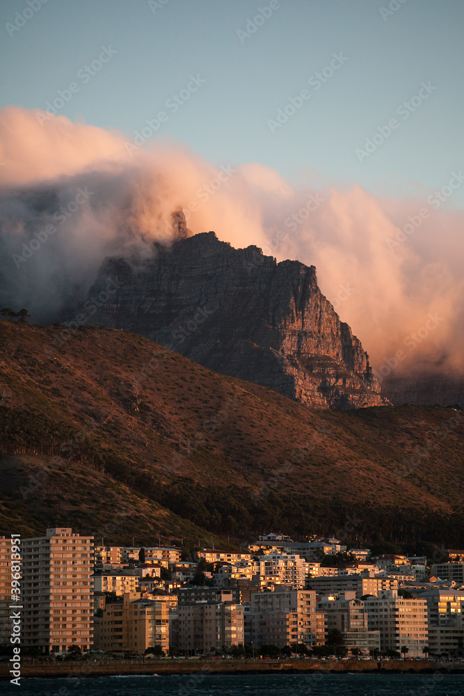Clouds rolling over Table Mountain in Cape Town South Africa obscuring the Cable Cart station on to of the mountain.