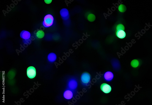 colorful Christmas lights bokeh on a black background