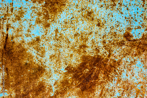 Rust on a painted blue metal surface.