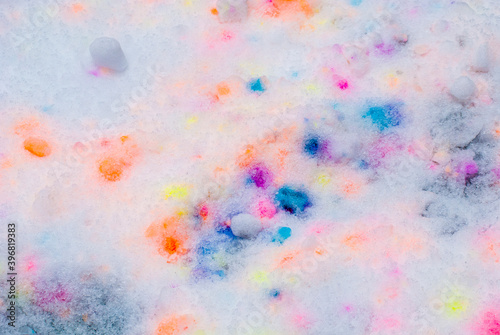 Abstraction colored spots on fresh snow.