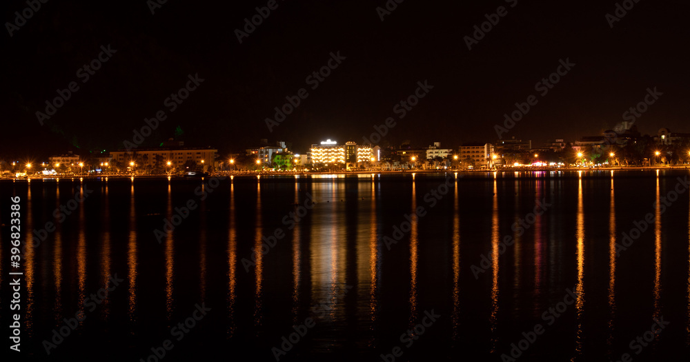 Sea city at night and its reflection in the water, Turkey, Marmaris