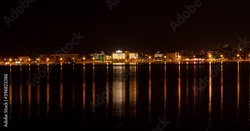 Sea city at night and its reflection in the water, Turkey, Marmaris