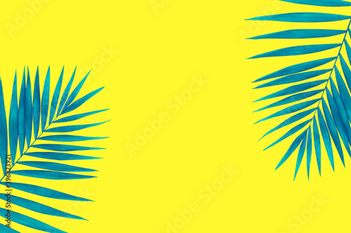 Sunny. Exotic blue tropical palm leaves isolated on bright yellow background. Design for invitation cards, flyers. Abstract design templates for posters, covers, wallpapers with copyspace for text.