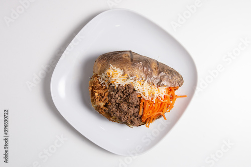 Delicious stuffed sweet potato with minced meat, carrot and cheese