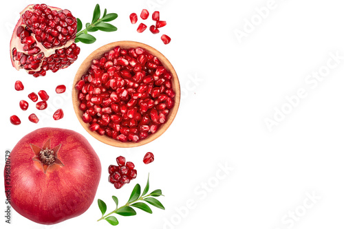Pomegranate seeds in wooden bowl isolated on white background. Top view with copy space for your text. Flat lay