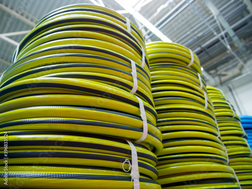 New irrigation hoses stacked in a warehouse