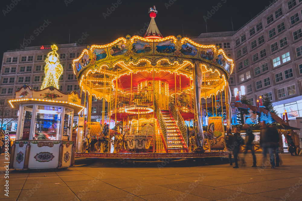 A christmas carousel for children on alexanderplatz in berlin, germany