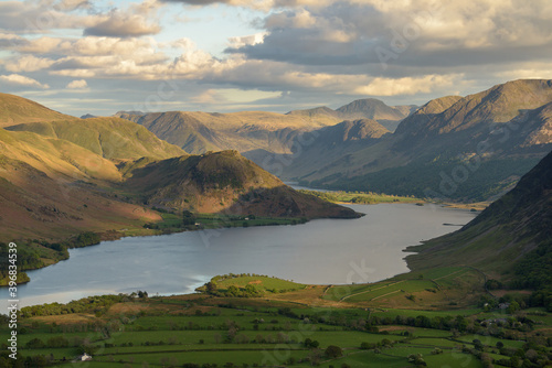 Aerial view of Crummock Water lake on a Summer evening with dramatic clouds. Western Fells  Lake District  UK.