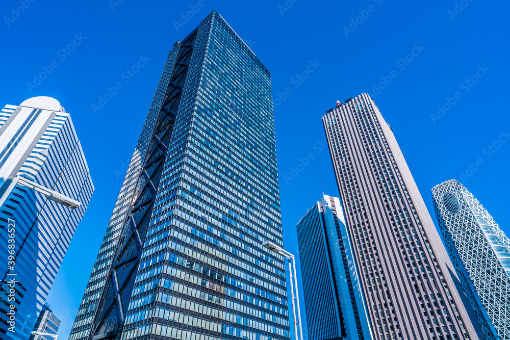 Asia, Real Estate, Corporate Construction and Business Concepts - Office Buildings and Blue Sky in Shinjuku, Tokyo, Japan