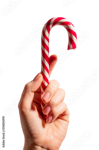 Christmas cane in woman's hand