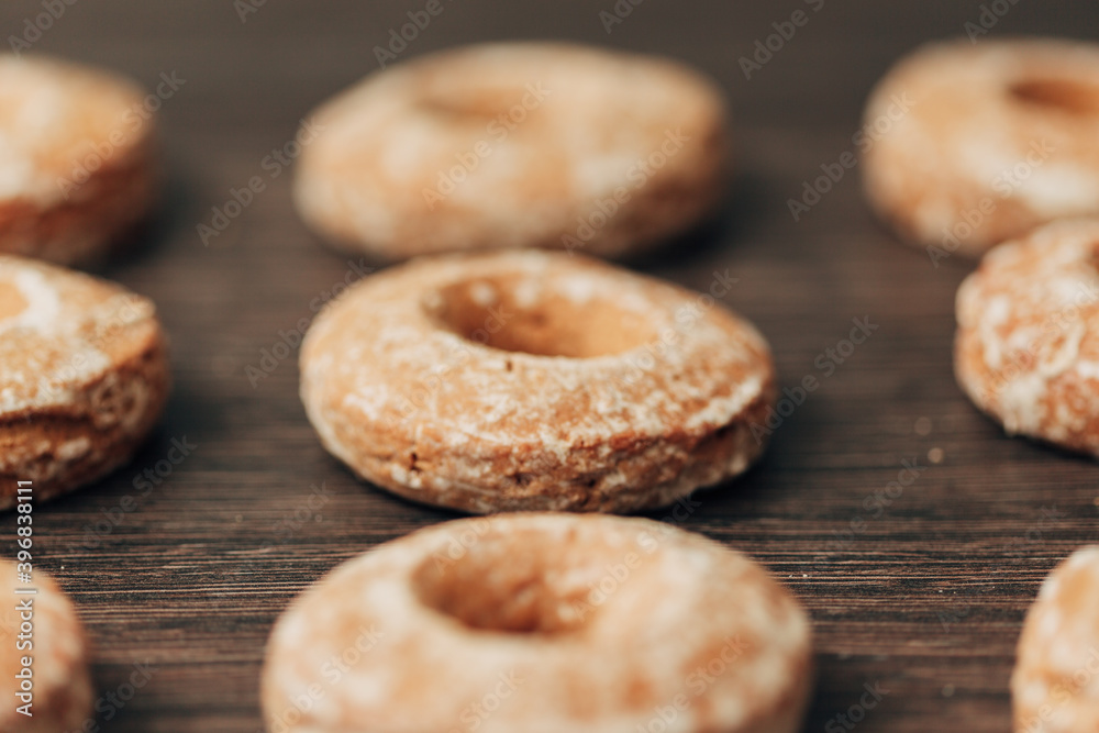 Beautiful Bagels and Gingerbreads Lie on a Brown Background