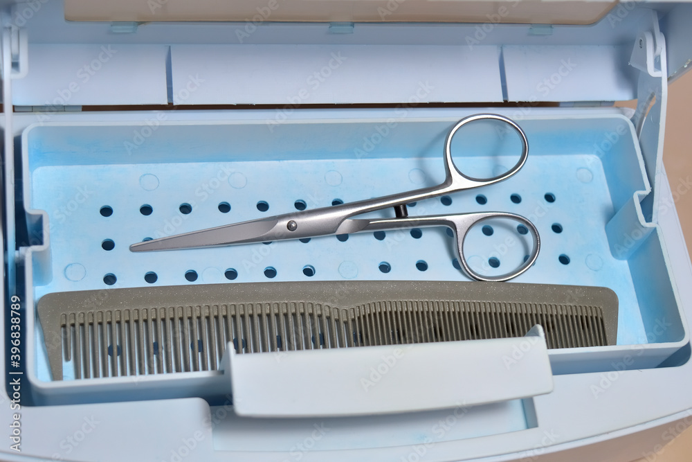 hairdressing tools in a sanitizing box for disinfecting and cleaning