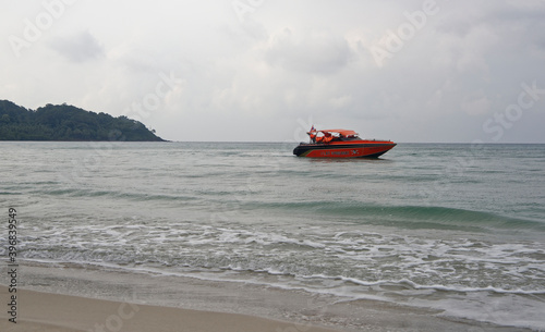 Boat sail near the beach of the paradise coconut island
