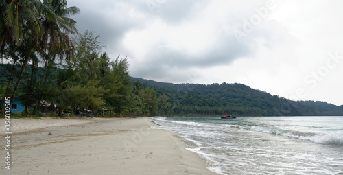 Boat sail near the beach of the paradise coconut island photo