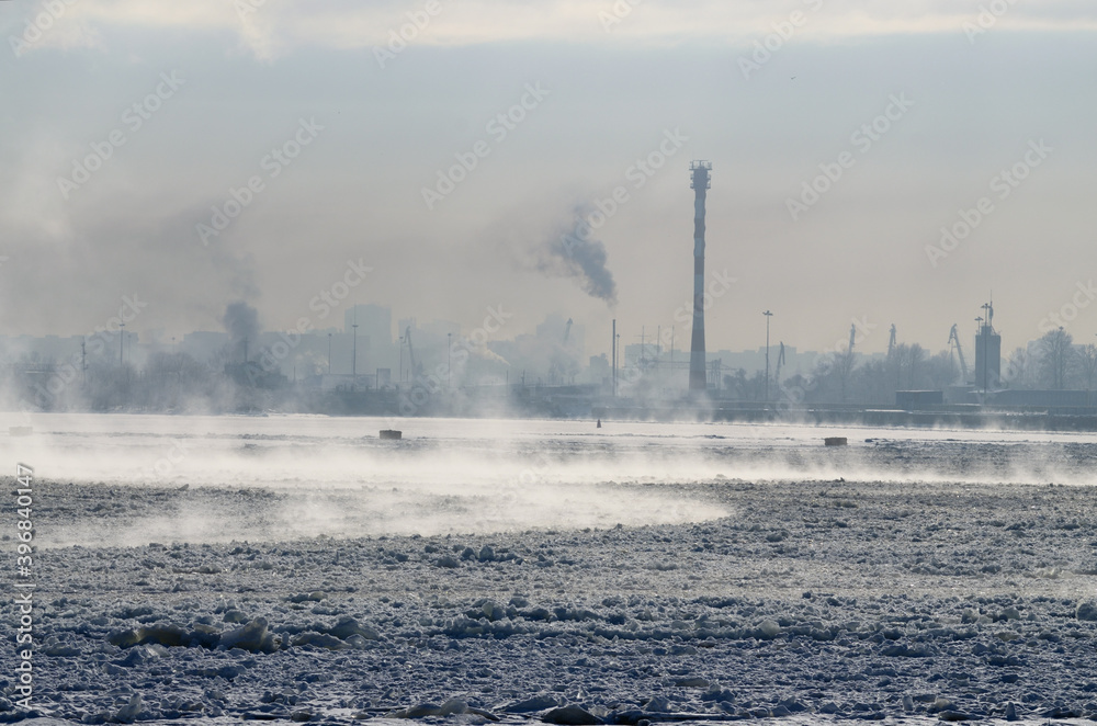 The water in the port was covered with ice from the frost.