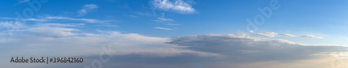 Fototapeta Naklejka Na Ścianę i Meble -  Fluffy clouds in evening overcast sky panoramic view. Climate, environment and weather concept sky background.