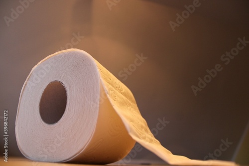 Fotografi Rolls of toilet paper on a wooden underground