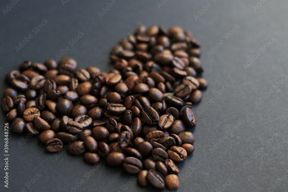 roasted coffee beans heart on black background roasted coffee beans heart on black background