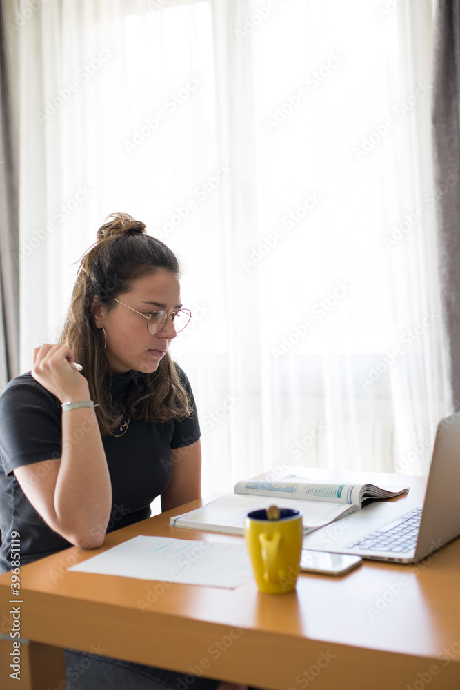 A student taking an online class from home A student taking an online class from home