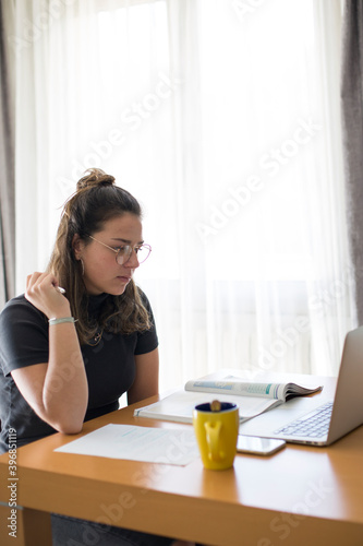 A student taking an online class from home