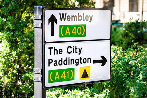 Canvas Print United Kingdom road sign directions to Wembley stadium, city of paddington in su