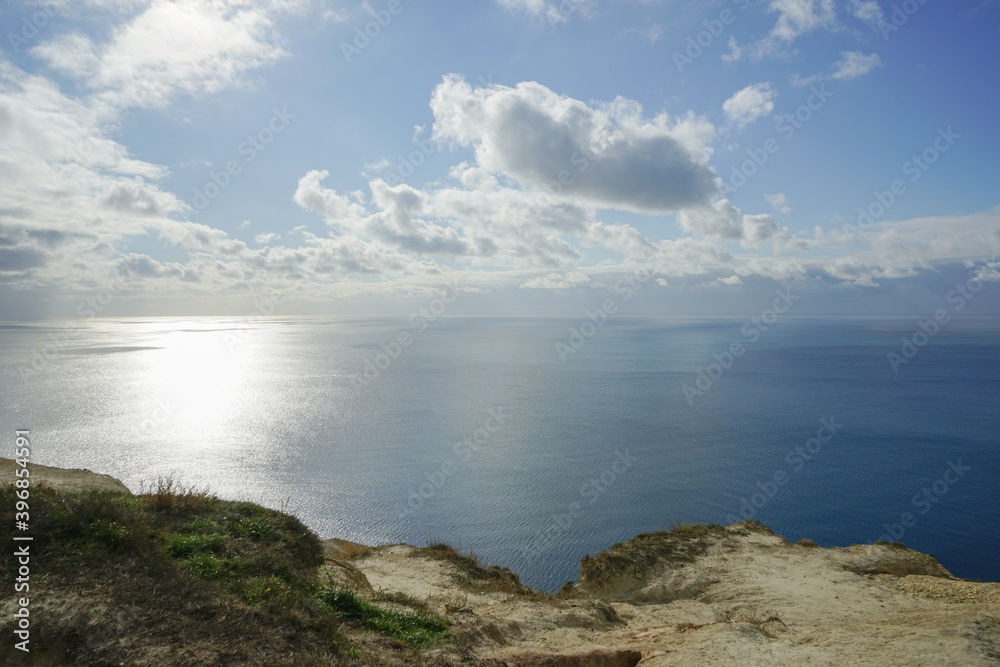 beautiful seascape with mysterious sky and fluffy clouds beautiful seascape with mysterious sky and fluffy clouds