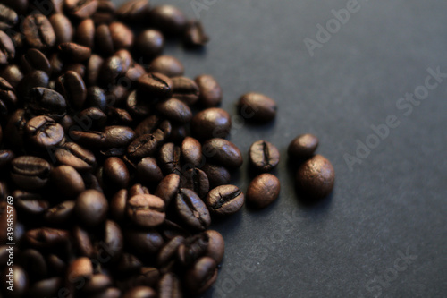 roasted coffee beans on black background