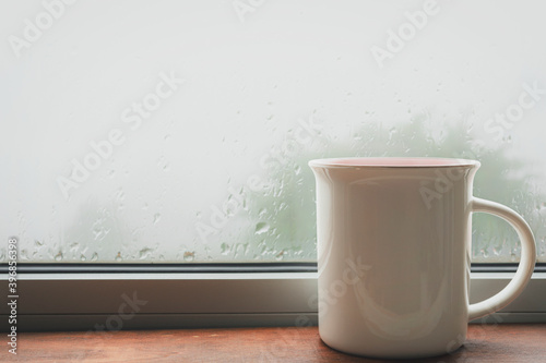 Cup of tea on the windowsill, close-up