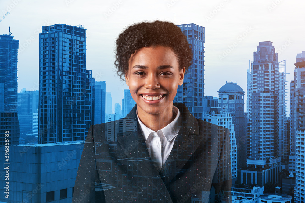 Successful smiling black African American business woman in suit. Bangkok cityscape. The concept of woman in business. Legal consultant. Double exposure. Successful smiling black African American business woman in suit. Bangkok cityscape. The concept of woman in business. Legal consultant. Double exposure.