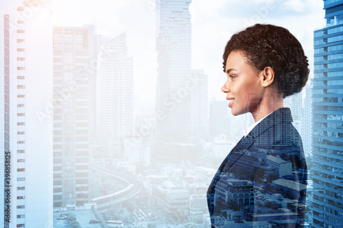 Successful smiling black African American business woman in suit. Bangkok cityscape. The concept of woman in business. Legal consultant. Double exposure.