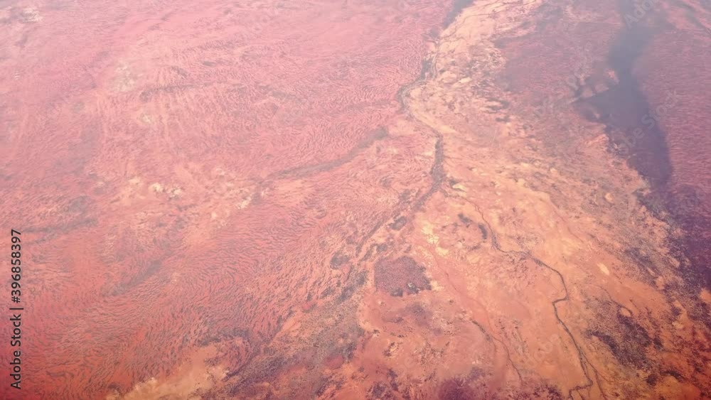 Aerial view of Alice Springs desert in Macdonnell ranges of Australia. Scenic flight with Red Centre desert of Northern Territory in Central Australia outback. Aerial view of Alice Springs desert in Macdonnell ranges of Australia. Scenic flight with Red Centre desert of Northern Territory in Central Australia outback.