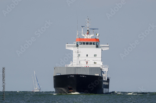 MERCHANT VESSEL - Freighter is sailing on the waterway