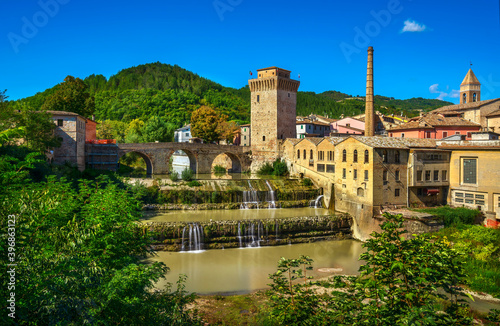 Fototapeta Naklejka Na Ścianę i Meble -  Roman bridge, medieval tower and Metauro river. Fermignano, Marche, Italy.