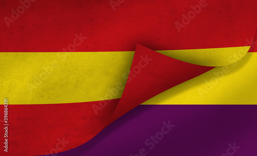 Spanish flag over the Republican Flag “tricolor”, symbol of the historical conflict in Spain 