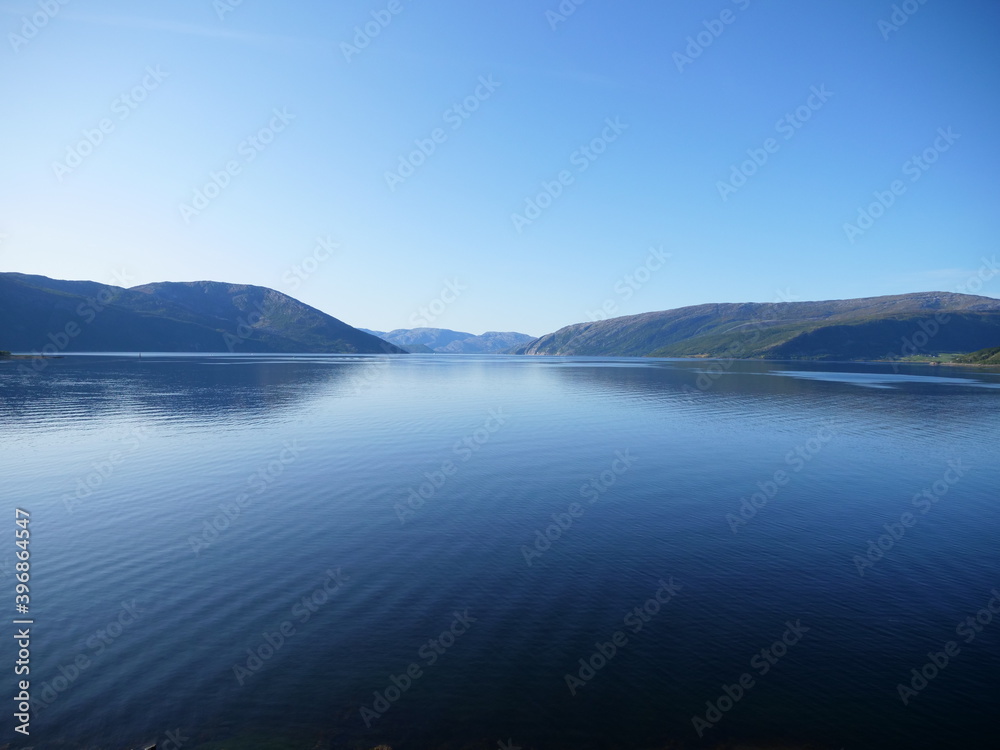 A fjord in Norway during a sunny day of summer.