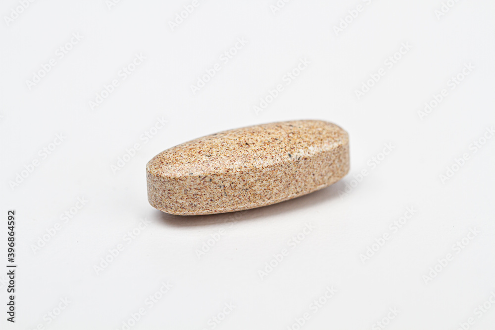 Brown natural supplement tablet Brown natural supplement tablet