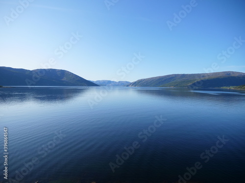 A fjord in Norway during a sunny day of summer.
