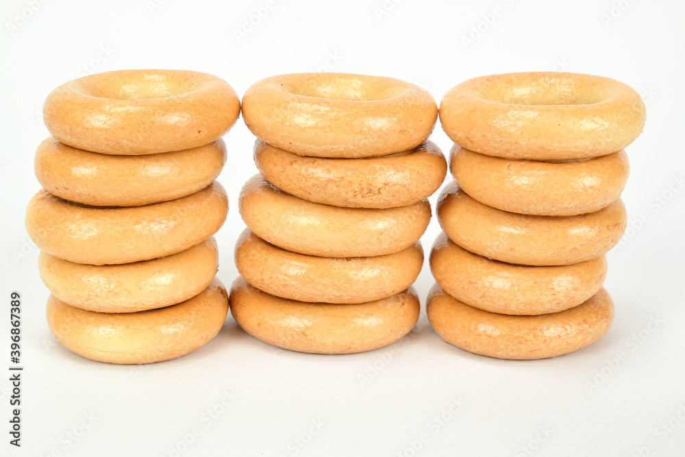 Bagels composed in three stacks and isolated on a white background. Bagels composed in three stacks and isolated on a white background.