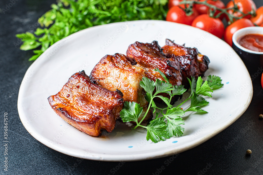 grilled ribs BBQ pork in spices and tomato sauce piece of meat second course snack ready to eat on the table healthy meal snack ingredient top view copy space for text food background rustic grilled ribs BBQ pork in spices and tomato sauce piece of meat second course snack ready to eat on the table healthy meal snack ingredient top view copy space for text food background rustic