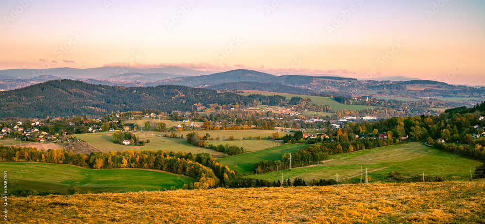 Autumn hilly landscape at sunset time