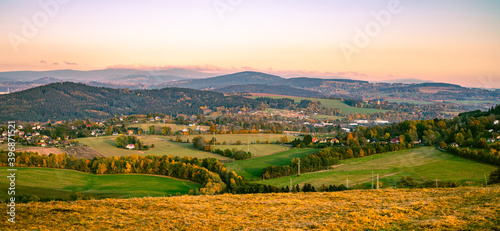 Autumn hilly landscape at sunset time