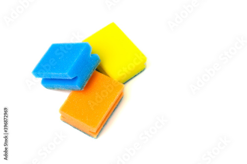 Dishwashing sponges of different colors on a white background. Close-up. Copy space.