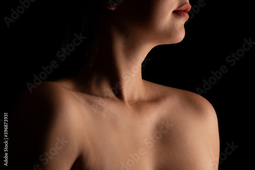 Sensual picture of woman's neck. Nude photography with visible collarbones.