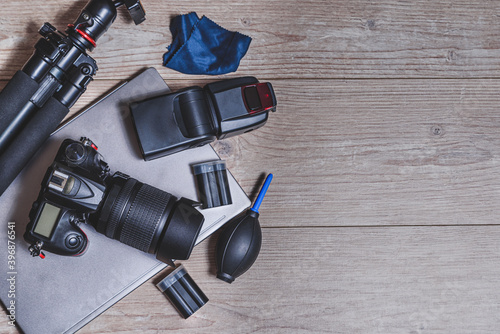 top view of professional photography gear on the top of a wooden table