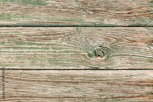 Wood knot background. Grunge wooden texture. Dry desk cracks pattern. Cut tree slice cross section. Peel paint texture.
