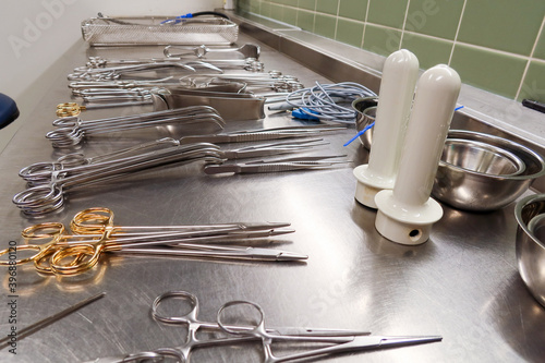 many Cleaned and disinfected instruments lie in a sterilization department of a hospital